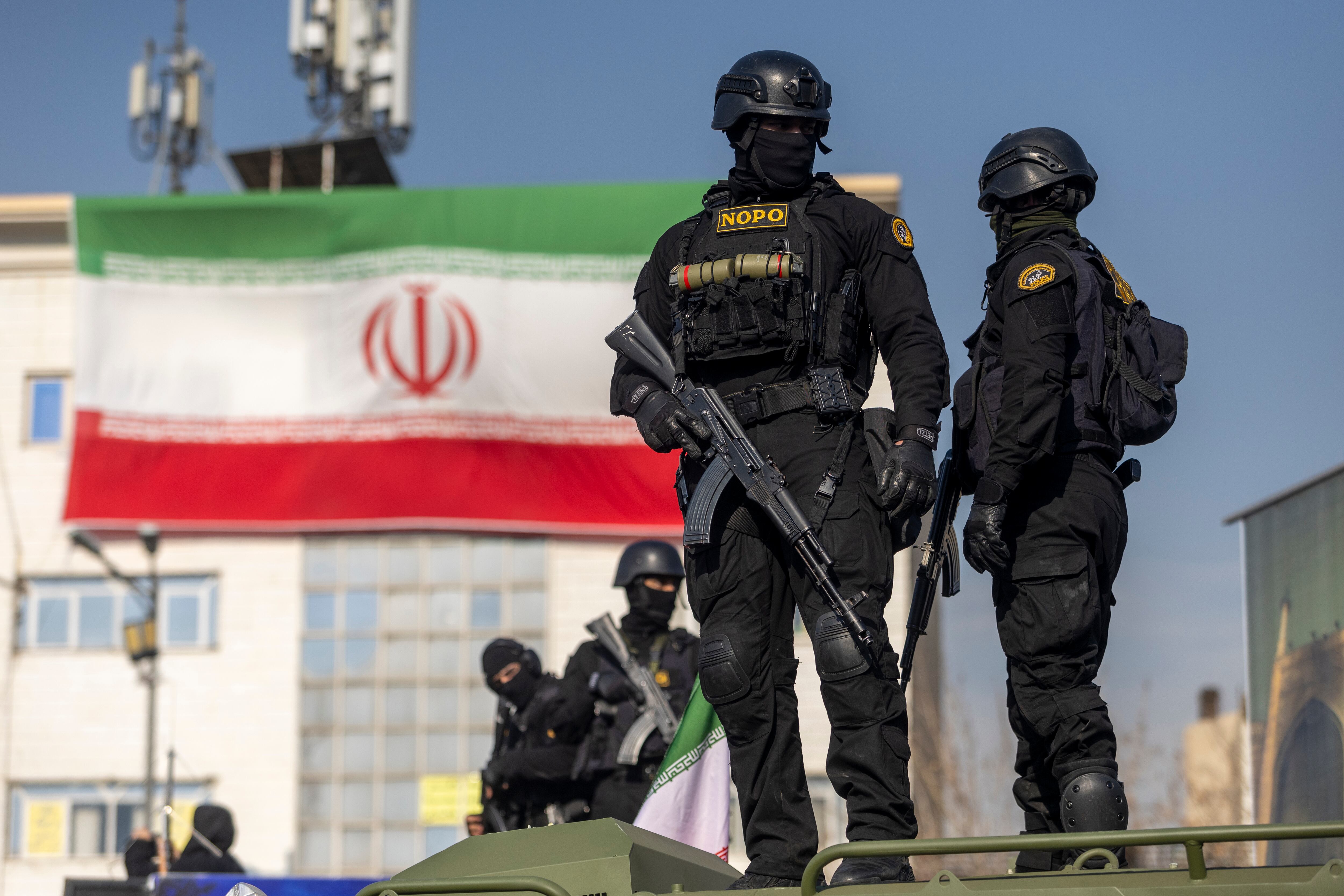TEHRAN, IRAN - JANUARY 12: Security forces are seen during a pro-government rally on January 12, 2026 in Tehran, Iran. Tens of thousands of demonstrators gathered in Tehran's Enqelab Square on Monday, as Mohammad Bagher Ghalibaf, speaker of the Iranian parliament, made a speech denouncing western intervention in Iran, following ongoing anti-government protests. In recent days, US President Donald Trump has repeatedly threatened military action if Iranian security forces kill protesters. (Photo by Stringer/Getty Images)