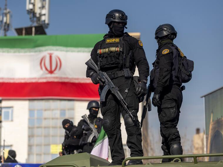 TEHRAN, IRAN - JANUARY 12: Security forces are seen during a pro-government rally on January 12, 2026 in Tehran, Iran. Tens of thousands of demonstrators gathered in Tehran's Enqelab Square on Monday, as Mohammad Bagher Ghalibaf, speaker of the Iranian parliament, made a speech denouncing western intervention in Iran, following ongoing anti-government protests. In recent days, US President Donald Trump has repeatedly threatened military action if Iranian security forces kill protesters. (Photo by Stringer/Getty Images)
