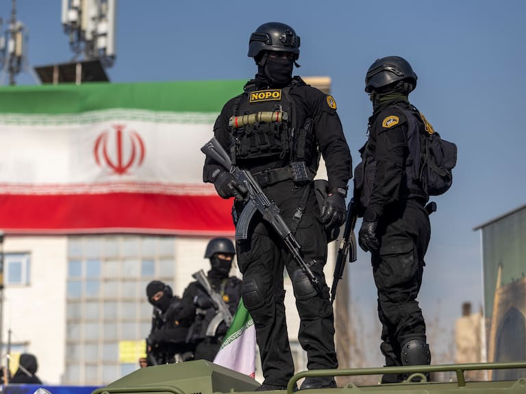TEHRAN, IRAN - JANUARY 12: Security forces are seen during a pro-government rally on January 12, 2026 in Tehran, Iran. Tens of thousands of demonstrators gathered in Tehran's Enqelab Square on Monday, as Mohammad Bagher Ghalibaf, speaker of the Iranian parliament, made a speech denouncing western intervention in Iran, following ongoing anti-government protests. In recent days, US President Donald Trump has repeatedly threatened military action if Iranian security forces kill protesters. (Photo by Stringer/Getty Images)