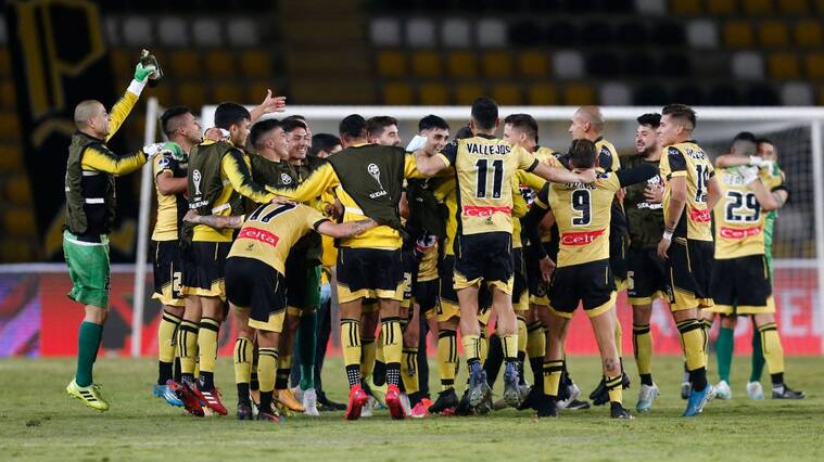 Chile's Coquimbo players celebrate after a Copa Sudamericana quarterfinal football match against Colombia's Junior at the Bicentenario Francisco Sanchez Rumoroso stadium in Coquimbo, Chile, on December 16, 2020. (Photo by JAVIER TORRES / AFP) (Photo by JAVIER TORRES/AFP via Getty Images)