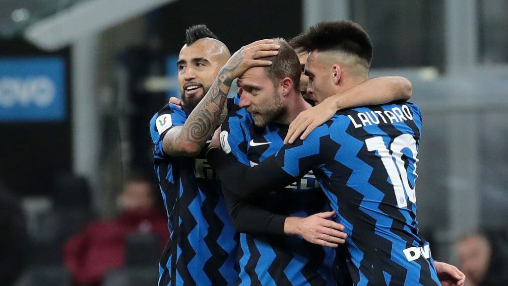 MILAN, ITALY - JANUARY 26: Christian Eriksen celebrates his goal with Arturo Vidal and Lautaro Martínez during the Coppa Italia match between FC Internazionale and AC Milan at Stadio Giuseppe Meazza on January 26, 2021 in Milan, Italy. Sporting stadiums around Italy remain under strict restrictions due to the Coronavirus Pandemic as Government social distancing laws prohibit fans inside venues resulting in games being played behind closed doors. (Photo by Emilio Andreoli - Inter/Inter via Getty Images)