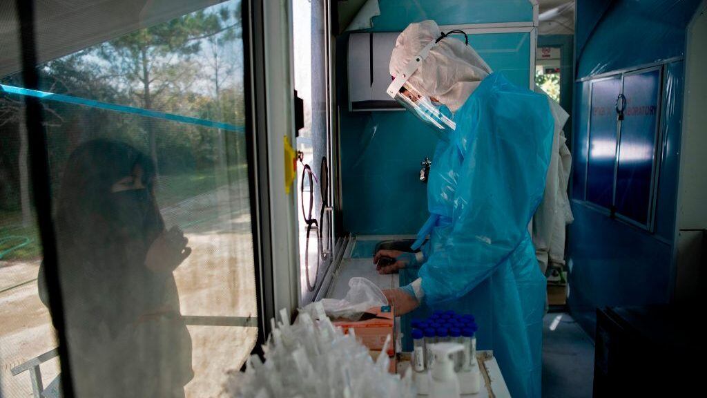 A nurse prepares to carry out a PCR test for the novel coronavirus at the mobile medical center of the municipality of El Bosque, in Santiago on August 25, 2020. - After critical weeks in May and June, Chile managed to keep the new cases of coronavirus stable in most of the country. To avoid upsurges, it is now investing efforts to continue testing massively and to reinforce traceability, the key link to lift quarantines. (Photo by MARTIN BERNETTI / AFP) (Photo by MARTIN BERNETTI/AFP via Getty Images)
