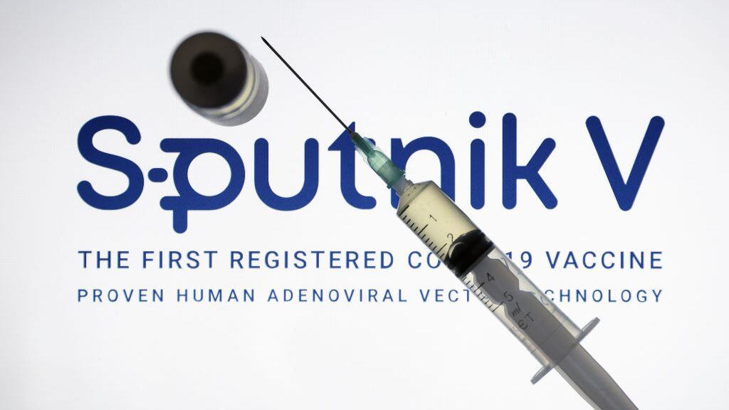 ANKARA, TURKEY - DECEMBER 24: In this photo illustration taken in Ankara, Turkey on December 24, 2020 Sputnik V, (Gam-COVID-Vac), COVID-19 vaccine logo is displayed on a screen with a syringe and a flacon in the front.. (Photo by Hakan Nural/Anadolu Agency via Getty Images)