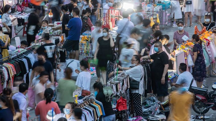 WUHAN, CHINA - JUNE 12, 2020 - In front of Dayang department store, Jianghan Road, Wuhan, a large number of citizens browse in the night market. Wuhan, Hubei Province, China, on the evening of June 12, 2020. Since 0:00 on June 13, the emergency response level of public health emergencies in Hubei Province has been adjusted from level II to level III, and the relevant prevention and control strategies have been adjusted accordingly.- PHOTOGRAPH BY Costfoto / Barcroft Studios / Future Publishing (Photo credit should read Costfoto/Barcroft Media via Getty Images)