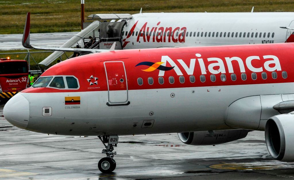 Aircrafts of Colombian company Avianca are seen on the tarmac at El Dorado International Airport in Bogota on August 28, 2019. - Avianca Holdings, the largest airline in Colombia and the second largest in Latin America, denied being bankrupt on August 27 after a leaked video in which the president of the board of directors ensures that the company is "broken" went viral in social media. (Photo by Juan BARRETO / AFP) (Photo credit should read JUAN BARRETO/AFP via Getty Images)
