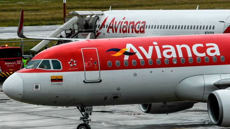 Aircrafts of Colombian company Avianca are seen on the tarmac at El Dorado International Airport in Bogota on August 28, 2019. - Avianca Holdings, the largest airline in Colombia and the second largest in Latin America, denied being bankrupt on August 27 after a leaked video in which the president of the board of directors ensures that the company is "broken" went viral in social media. (Photo by Juan BARRETO / AFP) (Photo credit should read JUAN BARRETO/AFP via Getty Images)