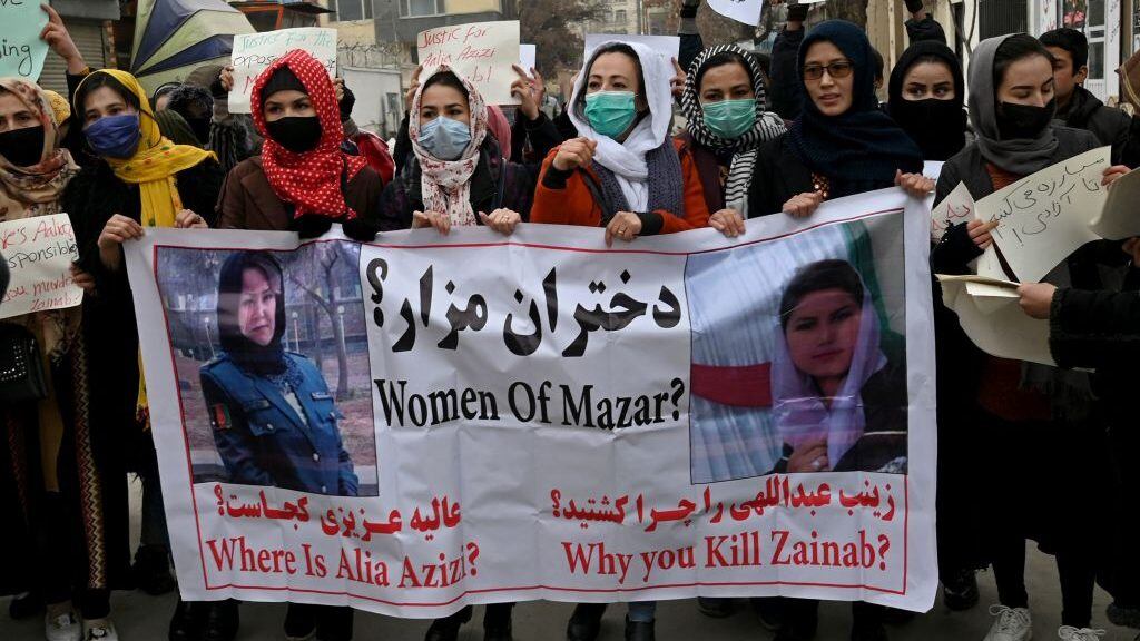 Afghan women march as they chant slogans and hold banners during a women's rights protest in Kabul on January 16, 2022. (Photo by Wakil KOHSAR / AFP) (Photo by WAKIL KOHSAR/AFP via Getty Images)