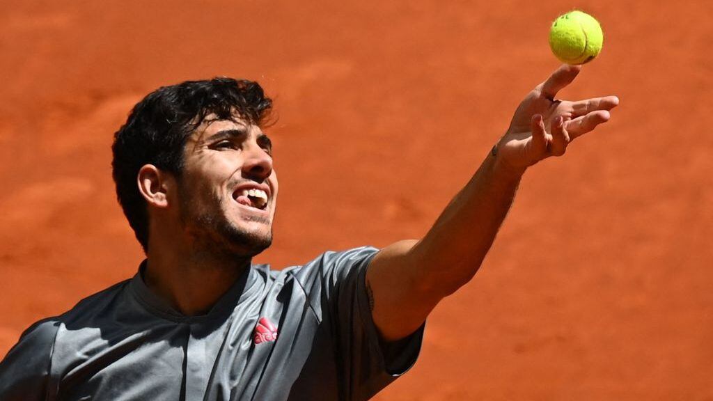 Chile's Christian Garin serves to Russia's Daniil Medvedev during their 2021 ATP Tour Madrid Open tennis tournament singles match at the Caja Magica in Madrid on May 6, 2021. (Photo by GABRIEL BOUYS / AFP) (Photo by GABRIEL BOUYS/AFP via Getty Images)