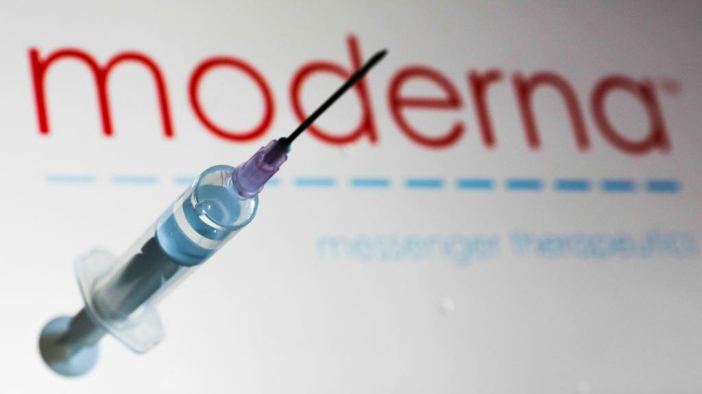 Medical syringe is seen with Moderna company logo displayed on a screen in the background in this illustration photo taken in Poland on June 12, 2020. American biotech company Moderna has announced on June 11 that will start final stage of covid-19 vaccine trial in July. (Photo Illustration by Jakub Porzycki/NurPhoto via Getty Images)