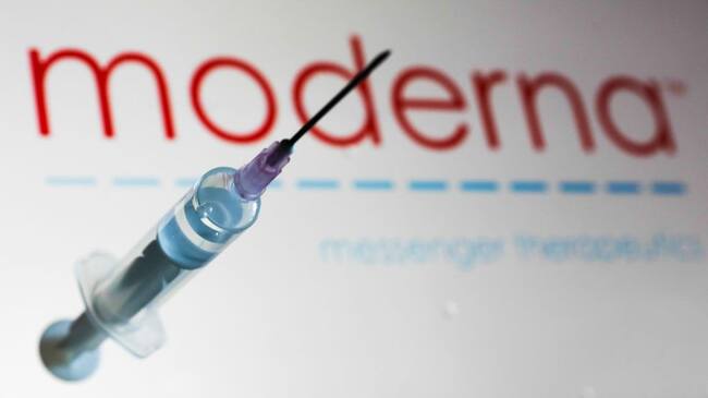 Medical syringe is seen with Moderna company logo displayed on a screen in the background in this illustration photo taken in Poland on June 12, 2020. American biotech company Moderna has announced on June 11 that will start final stage of covid-19 vaccine trial in July. (Photo Illustration by Jakub Porzycki/NurPhoto via Getty Images)
