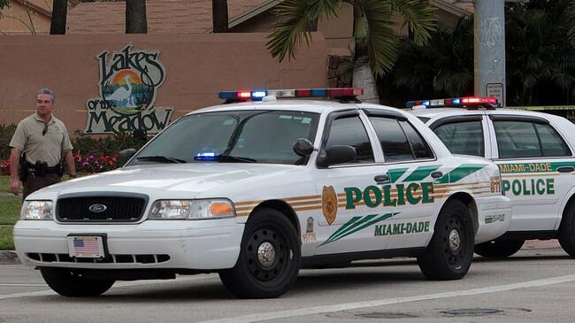 Miami-Dade police investigate a crime scene at the Lakes of the Meadow development in West Kendall, Florida, on Wednesday, February 20, 2013. Suspected marijuana growers engaged police in a shootout, and their home wound up in flames. Police have a suspect in custody and one is believed to have died in a suicide. (Roberto Koltun/El Nuevo Herald/Tribune News Service via Getty Images)