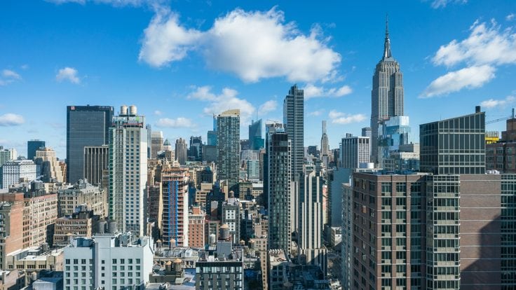 This high angle view from the Chelsea neighborhood in New York looks north toward midtown Manhattan. Some of the prominent buildings seen here are the Empire State Building, 1 Penn Plaza, and Bank of America Tower.