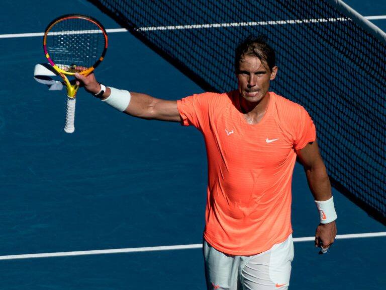 MELBOURNE, AUSTRALIA - FEBRUARY 09: Rafael Nadal of Spain waves to the crowd in his Men's Singles first round match against Laslo Djere of Serbia during day two of the 2021 Australian Open at Melbourne Park on February 09, 2021 in Melbourne, Australia. (Photo by Andy Cheung/Getty Images)