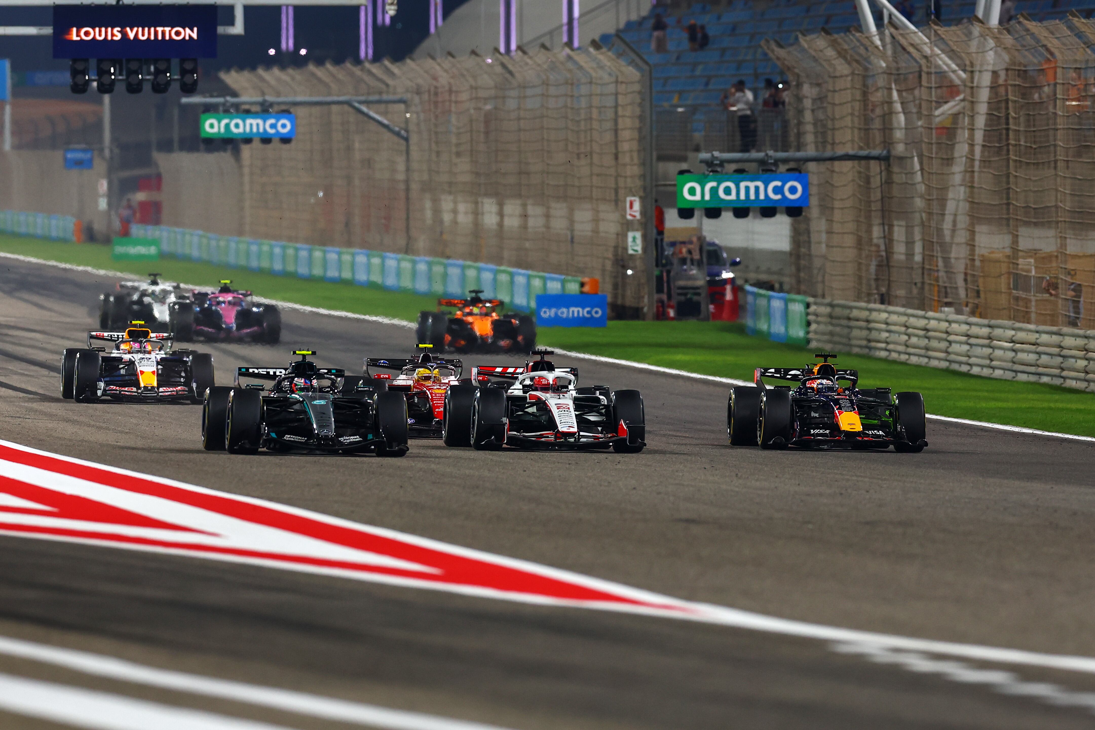 BAHRAIN, BAHRAIN - FEBRUARY 19: Andrea Kimi Antonelli of Italy driving the (12) Mercedes AMG Petronas F1 Team W17 leads Esteban Ocon of France driving the (31) Haas F1 VF-26 Ferrari Max Verstappen of the Netherlands driving the (3) Oracle Red Bull Racing RB22 Red Bull Ford Lewis Hamilton of Great Britain driving the (44) Scuderia Ferrari SF-26 and others as they practice their race start procedures during day two of F1 Testing at Bahrain International Circuit on February 19, 2026 in Bahrain, Bahrain. (Photo by Joe Portlock/Getty Images)