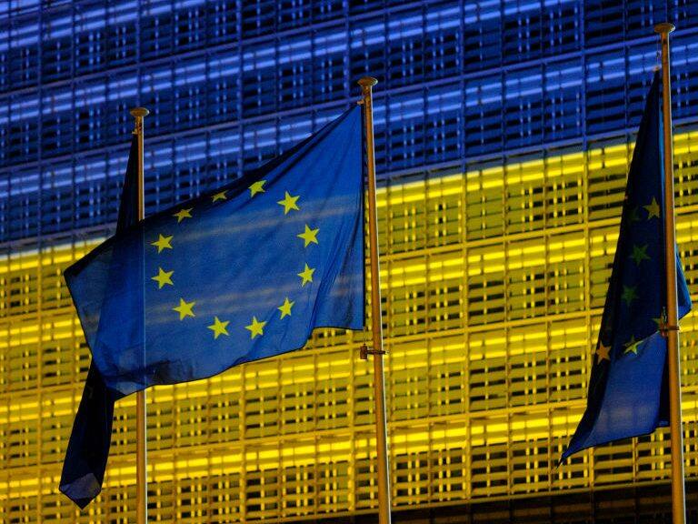 BRUSSELS, BELGIUM - MAY 8: The Berlaymont, the EU Commission headquarter is lighted in Blue and Yellow, the colors of the Ukrainan Flag on May 8, 2022, in Brussels, Belgium. According to American intelligence, May 9 marks a deadline for the Russian president, Vladimir Putin who intends to declare a victory or significant progress on the Ukrainian front. (Photo by Thierry Monasse/Getty Images)