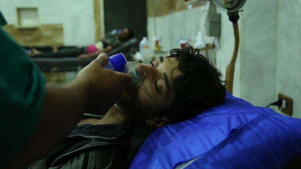 DAMASCUS, SYRIA - JULY 13: Syrians receive medical treatment after Assad regime's alleged chemical gas attack over oppositions' frontline, where is included in deconfliction zone in East Ghouta of Damascus, Syria on July 13, 2017. (Photo by Ammar Suleyman/Anadolu Agency/Getty Images)