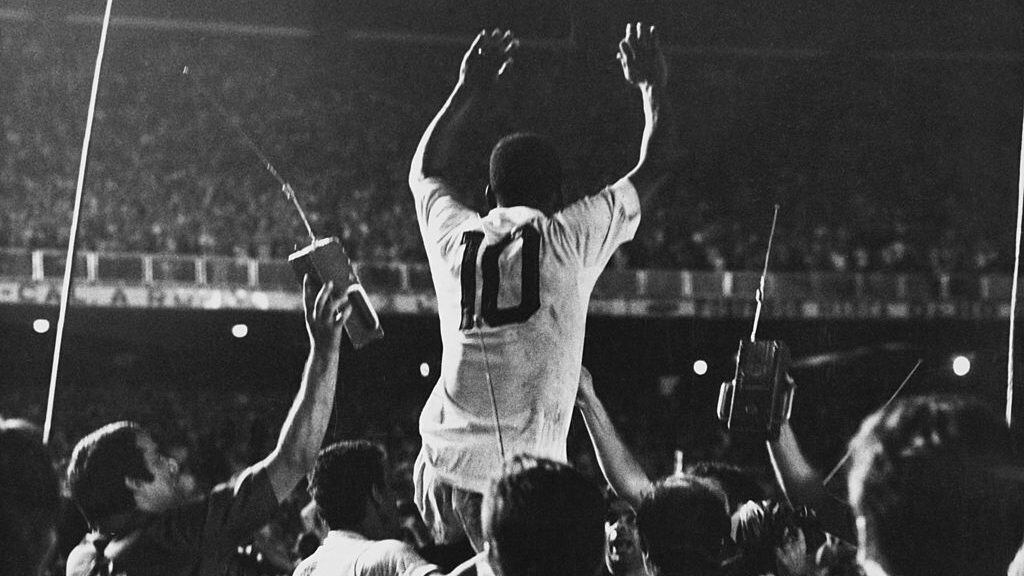Pele is lifted up by his Santos team mates after scoring the 1,000th goal of his career during a game against Vasco da Gama at the Maracana Stadium, Rio de Janeiro, Brazil, 19th November 1969. (Photo by Pictorial Parade/Archive Photos/Getty Images)