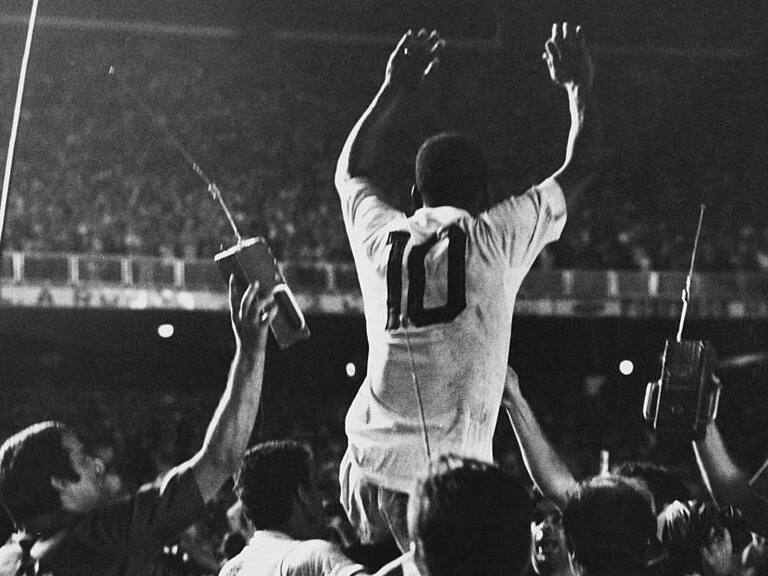 Pele is lifted up by his Santos team mates after scoring the 1,000th goal of his career during a game against Vasco da Gama at the Maracana Stadium, Rio de Janeiro, Brazil, 19th November 1969. (Photo by Pictorial Parade/Archive Photos/Getty Images)