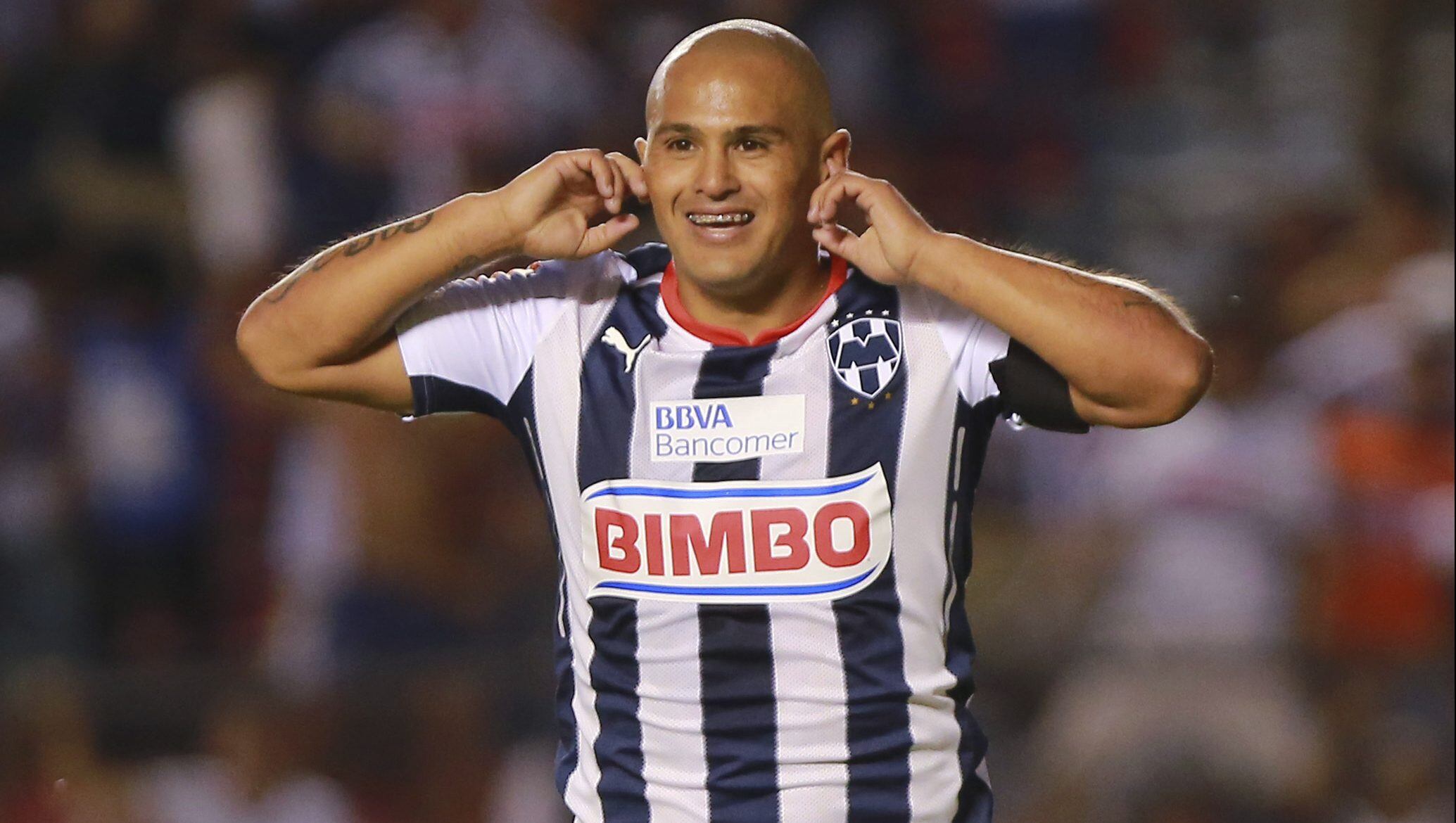 QUERETARO, MEXICO - AUGUST 29:  Humberto Suazo of Monterrey celebrates after scoring the only goal of a match between Queretaro and Monterrey as part of 7th round Apertura 2014 Liga MX at Corregidora Stadium on August 29, 2014 in Queretaro, Mexico. (Photo by Hector Vivas/LatinContent via Getty Images)
