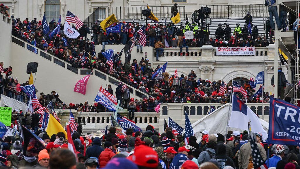 WASHINGTON, DC - JANUARY 6: Protesters take over the Inaugural stage during a protest calling for legislators to overturn the election results in President Donald Trump's favor at the U.S. Capitol on January 6, 2021 in Washington, D.C. (Photo by Ricky Carioti/The Washington Post via Getty Images)