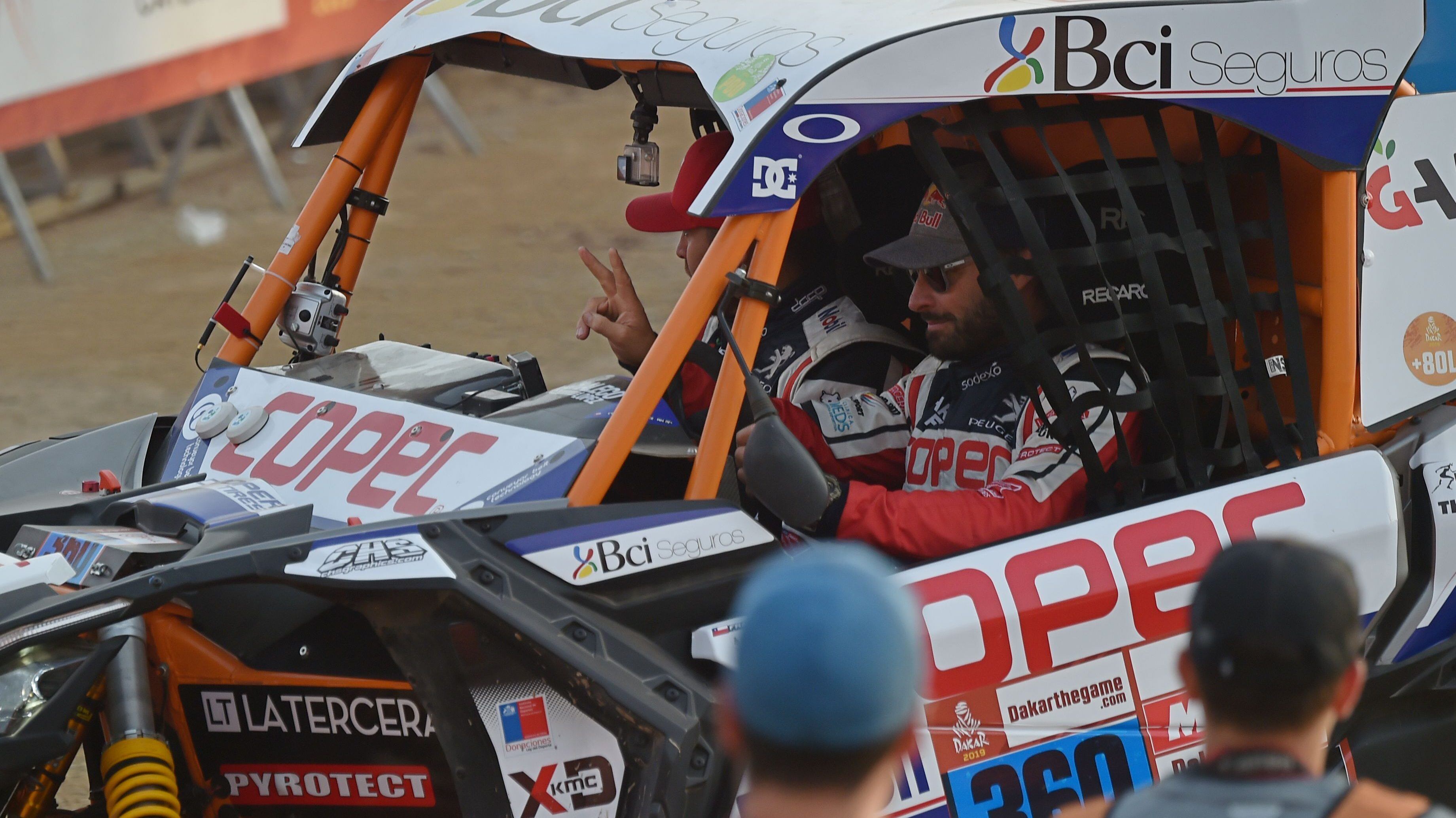 Chile's driver Francisco Lopez (R) and co-driver Alvaro Juan Leon on their SxS are pictured during the departure ceremony of the 2019 Dakar Rally in Lima, on January 6, 2019. - The Dakar Rally 2019 brings together 334 vehicles -motorcycles, 4-wheel drives, and trucks- with drivers from 61 nations, 17 of which are women. Due to economic and political concerns that caused the withdrawal of other countries in the region, this will be the first time the Dakar Rally is held in one country. (Photo by Cris BOURONCLE / AFP)        (Photo credit should read CRIS BOURONCLE/AFP via Getty Images)