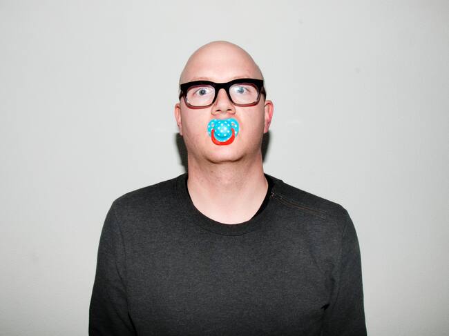 Acting like a baby, (self-)portrait of an adult wearing a dummy teat.
