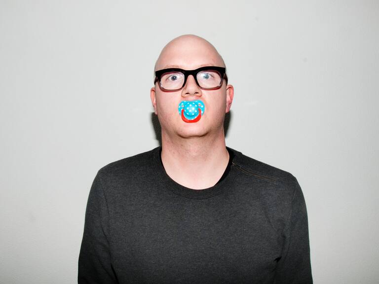 Acting like a baby, (self-)portrait of an adult wearing a dummy teat.