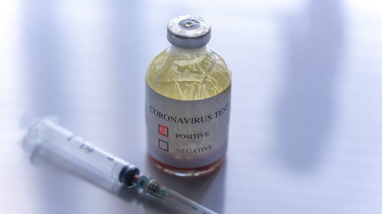 Syringe and ampoule containing coronavirus positive blood test