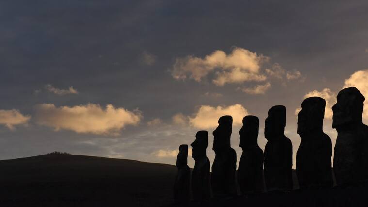 EASTER ISLAND, CHILE - 2019/09/22: Silhouette of Moais at ceremonial platform Ahu Tongariki seen during dawn at Rapa Nui National Park.Moais are monolithic human figures which represented the ancestors. They were carved by the Rapa Nui people at Rano Raraku, the main moai quarry on Easter Island in eastern French Polynesia between the years 1250 and 1500 coinciding with the arrival of the Polynesians on the island. Most of them were transported from there and set on stone platforms called Ahu around the island's perimeter. (Photo by John Milner/SOPA Images/LightRocket via Getty Images)