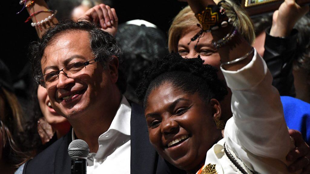 Newly elected Colombian President Gustavo Petro (L) and his running mate Francia Marquez (R) celebrate at the Movistar Arena in Bogota, on June 19, 2022 after winning the presidential runoff election on June 19, 2022. - Ex-guerrilla Gustavo Petro was on Sunday elected the first ever left-wing president of crisis-wracked Colombia after beating millionaire businessman rival Rodolfo Hernandez after a tense and unpredictable election. (Photo by Daniel MUNOZ / AFP) (Photo by DANIEL MUNOZ/AFP via Getty Images)