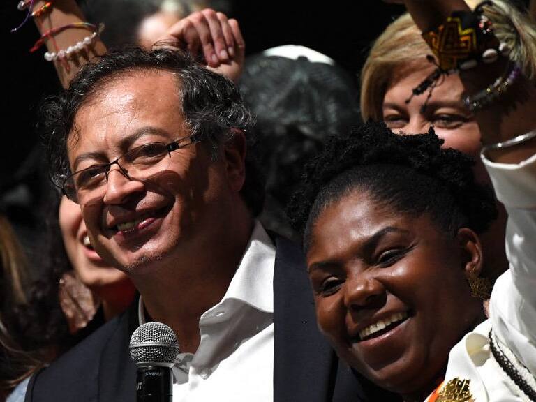 Newly elected Colombian President Gustavo Petro (L) and his running mate Francia Marquez (R) celebrate at the Movistar Arena in Bogota, on June 19, 2022 after winning the presidential runoff election on June 19, 2022. - Ex-guerrilla Gustavo Petro was on Sunday elected the first ever left-wing president of crisis-wracked Colombia after beating millionaire businessman rival Rodolfo Hernandez after a tense and unpredictable election. (Photo by Daniel MUNOZ / AFP) (Photo by DANIEL MUNOZ/AFP via Getty Images)