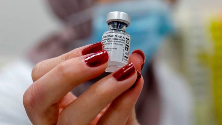 A healthcare worker prepares a dose of the COVID-19 vaccine at the Clalit Health Services in the Palestinian neighbourhood of Beit Hanina, in the Israeli-annexed east Jerusalem on January 7, 2021. (Photo by AHMAD GHARABLI / AFP) (Photo by AHMAD GHARABLI/AFP via Getty Images)