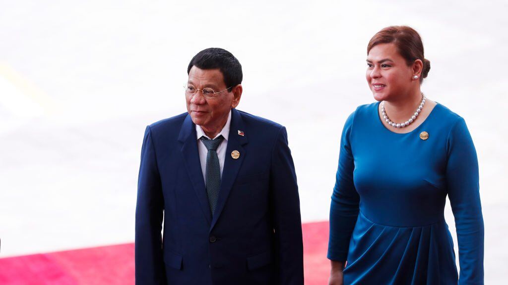 Philippine President Rodrigo Duterte (L) and his daughter Sara Duterte arrive for the opening of the Boao Forum for Asia (BFA) Annual Conference 2018 in Boao, south China's Hainan province on April 10, 2018. The BFA annual conference 2018 takes place between April 8-11. / AFP PHOTO / - / China OUT / The erroneous mention[s] appearing in the metadata of this photo by - has been modified in AFP systems in the following manner: [daughter Sara Duterte] instead of [wife Honeylet Avancena]. Please immediately remove the erroneous mention[s] from all your online services and delete it (them) from your servers. If you have been authorized by AFP to distribute it (them) to third parties, please ensure that the same actions are carried out by them. Failure to promptly comply with these instructions will entail liability on your part for any continued or post notification usage. Therefore we thank you very much for all your attention and prompt action. We are sorry for the inconvenience this notification may cause and remain at your disposal for any further information you may require.        (Photo credit should read -/AFP via Getty Images)