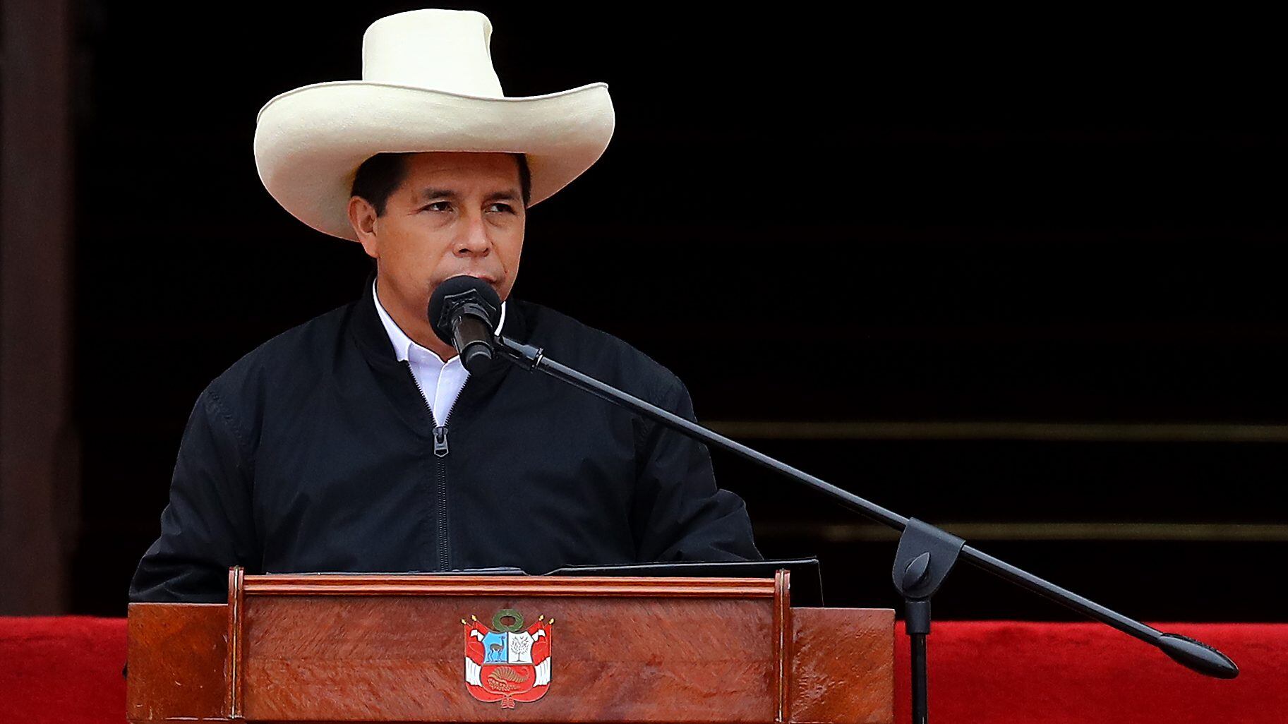 LIMA, PERU - DECEMBER 05: Peruvian President Pedro Castillo speaks during an event to deliver firetrucks to Volunteer firefighters of Peru on December 5, 2021 in Lima, Peru. After only four months in power, National Congress will vote this week on whether to start the formal impeachment process to Castillo. The Left-wing President will also be questioned by prosecutors on December 14th over promotions for military officers. (Photo by Leonardo Fernandez/Getty Images)