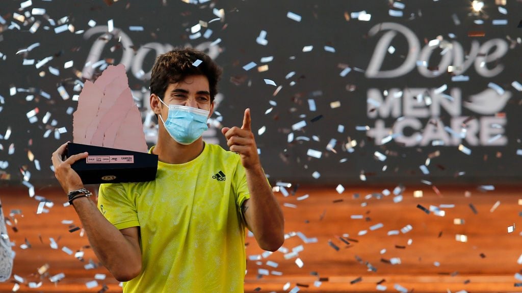 SANTIAGO, CHILE - MARCH 14: Cristian Garin of Chile celebrates with the trophy after winning the match against Facundo Bagnis of Argentina during the final of Chile Dove Men+Care Open at Club Deportivo Universidad Catolica on March 14, 2021 in Santiago, Chile. (Photo by Marcelo Hernandez/Getty Images)