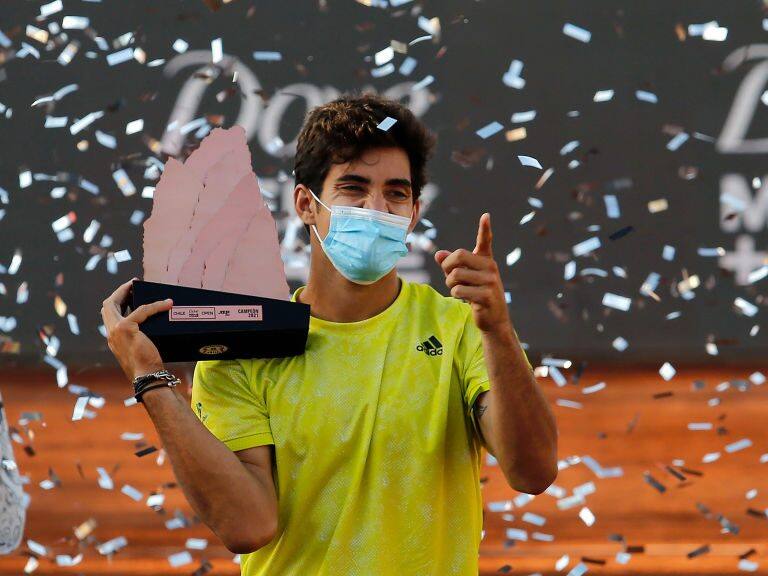 SANTIAGO, CHILE - MARCH 14: Cristian Garin of Chile celebrates with the trophy after winning the match against Facundo Bagnis of Argentina during the final of Chile Dove Men+Care Open at Club Deportivo Universidad Catolica on March 14, 2021 in Santiago, Chile. (Photo by Marcelo Hernandez/Getty Images)