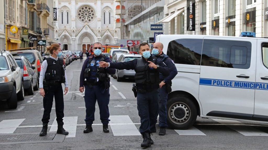 French policemen stand guard the street leading to the Basilica of Notre-Dame de Nice after a knife attack in Nice on October 29, 2020. - France's national anti-terror prosecutors said Thursday they have opened a murder inquiry after a man killed three people at a basilica in central Nice and wounded several others. The city's mayor, Christian Estrosi, told journalists at the scene that the assailant, detained shortly afterwards by police, "kept repeating 'Allahu Akbar' (God is Greater) even while under medication." He added that President Emmanuel Macron would be arriving shortly in Nice. (Photo by Valery HACHE / AFP) (Photo by VALERY HACHE/AFP via Getty Images)