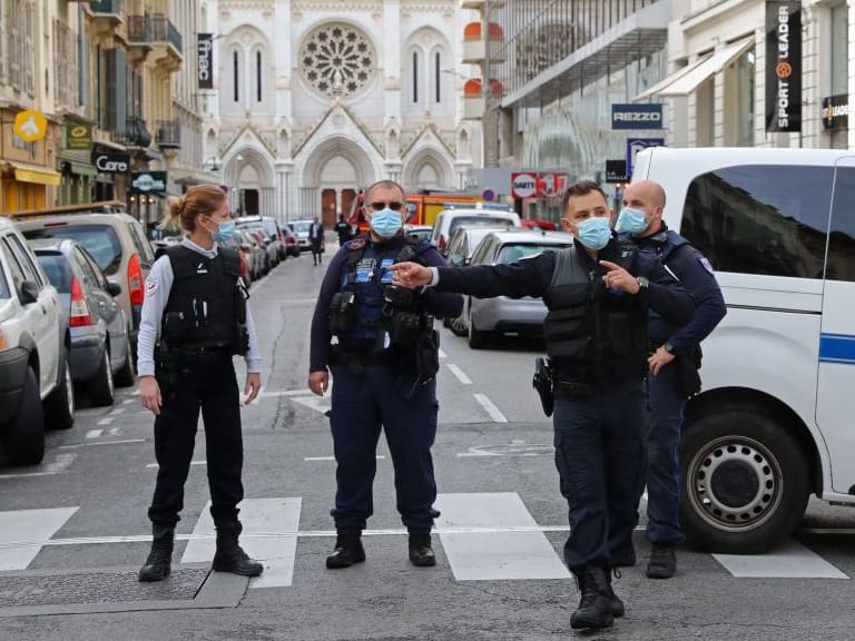French policemen stand guard the street leading to the Basilica of Notre-Dame de Nice after a knife attack in Nice on October 29, 2020. - France&#039;s national anti-terror prosecutors said Thursday they have opened a murder inquiry after a man killed three people at a basilica in central Nice and wounded several others. The city&#039;s mayor, Christian Estrosi, told journalists at the scene that the assailant, detained shortly afterwards by police, &quot;kept repeating &#039;Allahu Akbar&#039; (God is Greater) even while under medication.&quot; He added that President Emmanuel Macron would be arriving shortly in Nice. (Photo by Valery HACHE / AFP) (Photo by VALERY HACHE/AFP via Getty Images)
