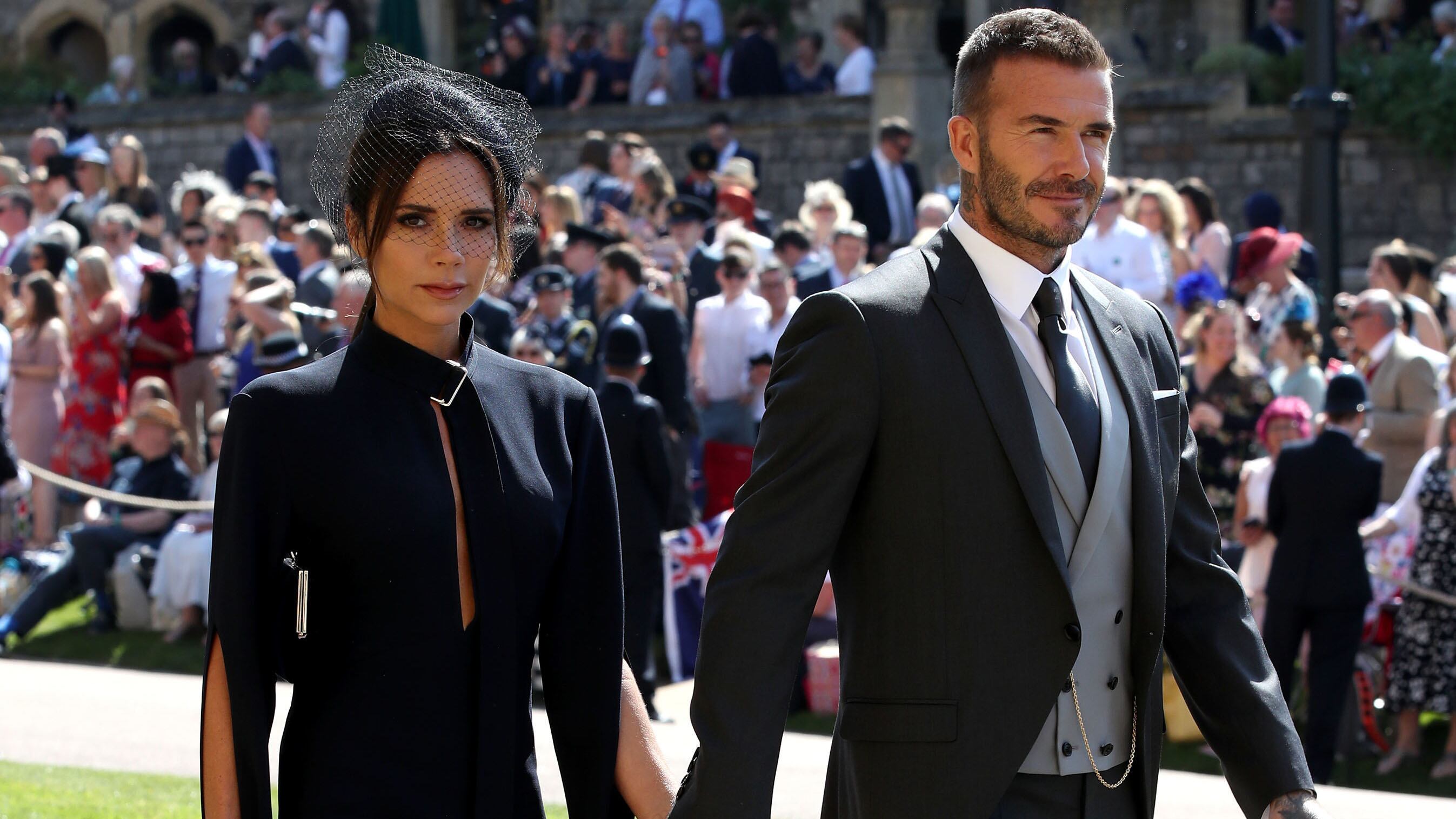 WINDSOR, UNITED KINGDOM - MAY 19: Victoria Beckham and David Beckham arrives for the wedding ceremony of Britain's Prince Harry and US actress Meghan Markle at St George's Chapel, Windsor Castle on May 19, 2018 in Windsor, England. (Photo by Chris Radburn - WPA Pool/Getty Images)