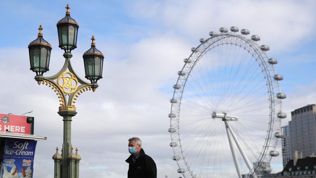 A man in a face mask in London, after Prime Minister Boris Johnson set out a new three-tier system of alert levels for England following rising coronavirus cases and hospital admissions. (Photo by Aaron Chown/PA Images via Getty Images)