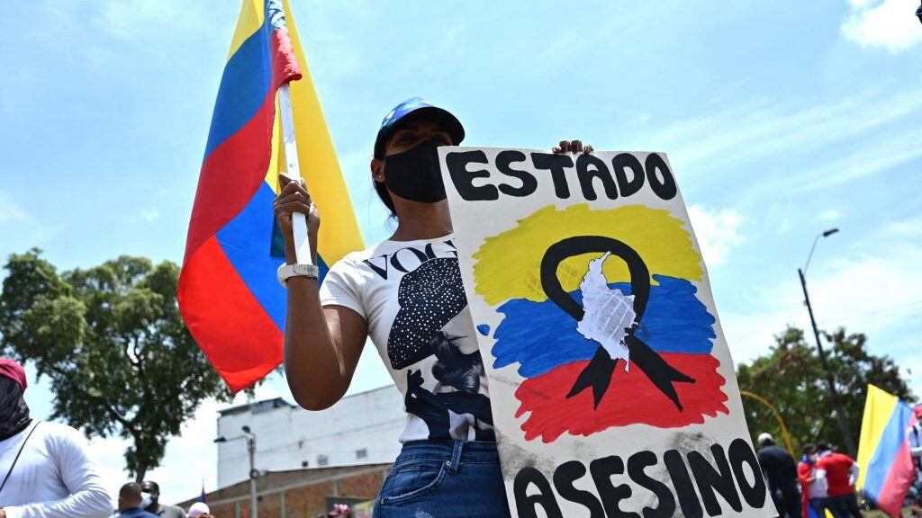 Demostrators block a street with a barricade during a protest against President Ivan Duque's government in Cali, Colombia on May 5, 2021. - Thousands of people returned to the streets of Colombia on Wednesday in rejection of the government of Ivan Duque, who has completed a week of pressure with demonstrations that turned violent in some cities and left some twenty people dead. (Photo by Luis ROBAYO / AFP) (Photo by LUIS ROBAYO/AFP via Getty Images)