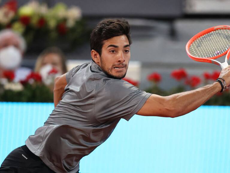 MADRID, SPAIN - MAY 07: Cristian Garín of Chile plays a backhand shot during their Quarter Final match against Matteo Berrettini of Italy during Day Nine of the Mutua Madrid Open at La Caja Magica on May 07, 2021 in Madrid, Spain. (Photo by Clive Brunskill/Getty Images)