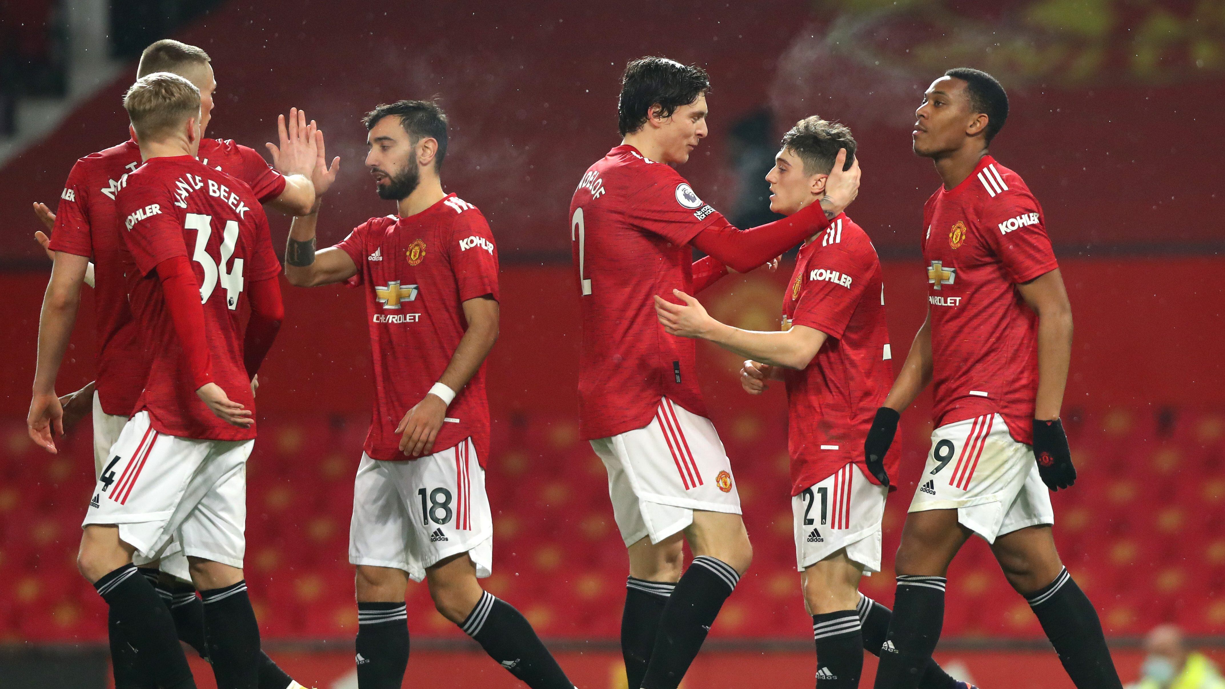 MANCHESTER, ENGLAND - FEBRUARY 02: Daniel James of Manchester United celebrates scoring his teams ninth goal during the Premier League match between Manchester United and Southampton at Old Trafford on February 02, 2021 in Manchester, England. Sporting stadiums around the UK remain under strict restrictions due to the Coronavirus Pandemic as Government social distancing laws prohibit fans inside venues resulting in games being played behind closed doors. (Photo by Chloe Knott - Danehouse/Getty Images)