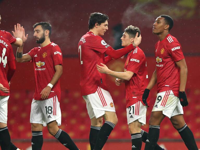 MANCHESTER, ENGLAND - FEBRUARY 02: Daniel James of Manchester United celebrates scoring his teams ninth goal during the Premier League match between Manchester United and Southampton at Old Trafford on February 02, 2021 in Manchester, England. Sporting stadiums around the UK remain under strict restrictions due to the Coronavirus Pandemic as Government social distancing laws prohibit fans inside venues resulting in games being played behind closed doors. (Photo by Chloe Knott - Danehouse/Getty Images)