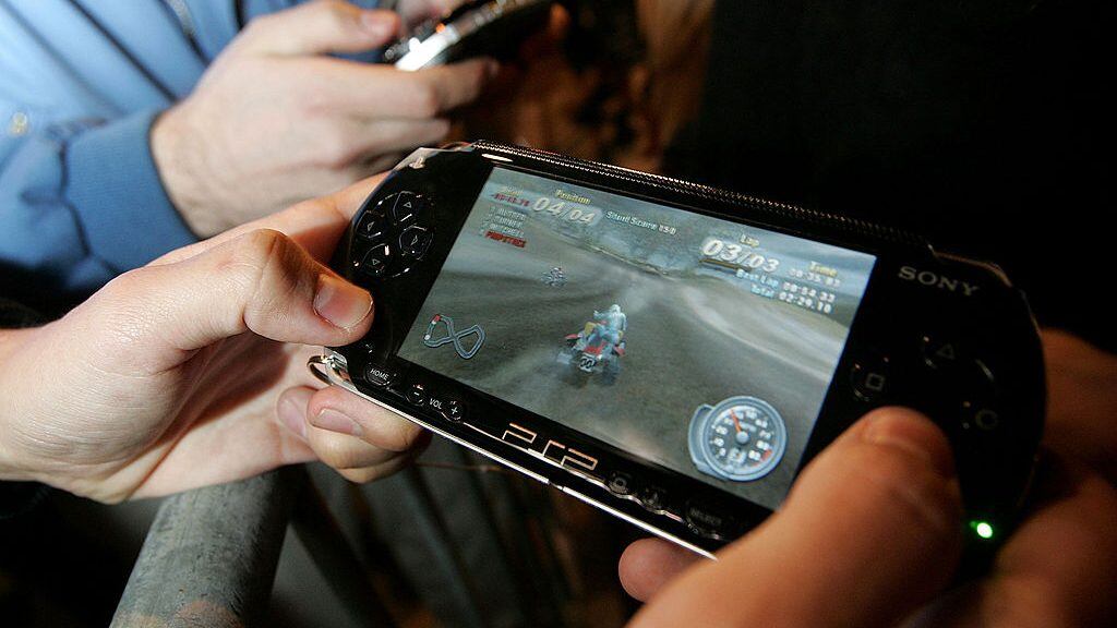 SAN FRANCISCO - MARCH 23: Curtis Anderson plays with a demonstration model of the new Sony PSP Playstation Portable gaming unit while waiting in line outside of the Sony Store March 23, 2005 in San Francisco, California. The much-anticipated portable version of the Sony Playstation will be released at midnight tonight throughout the United States. (Photo by Justin Sullivan/Getty Images)