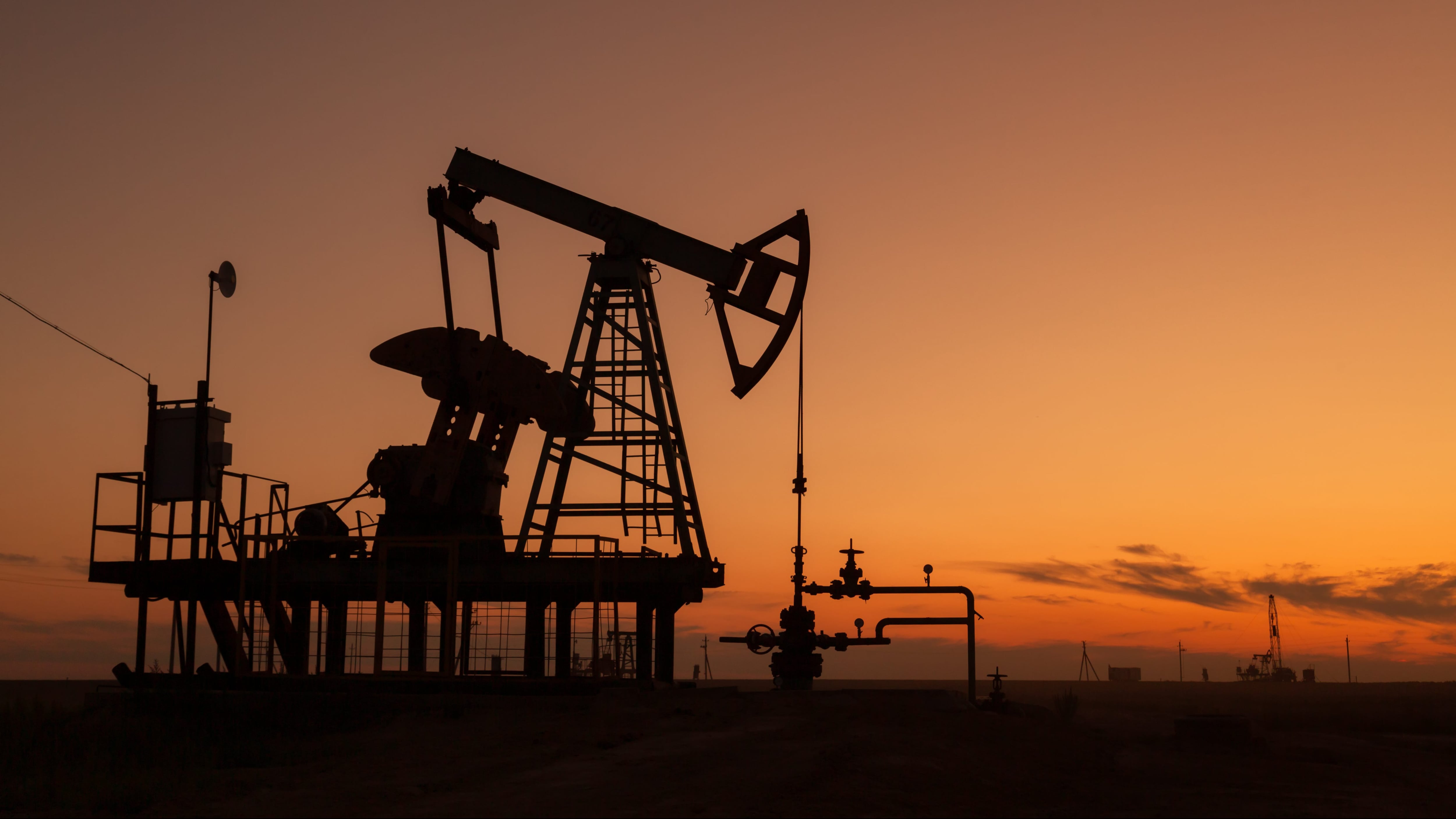 oil pumps at sunset, industrial oil pumps equipment.