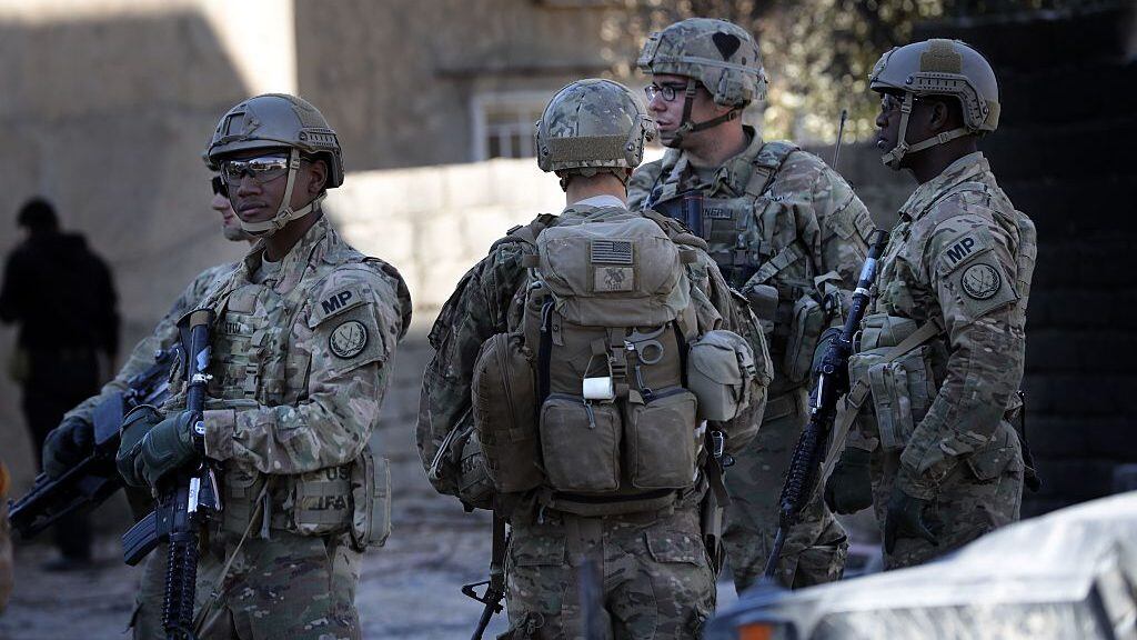 US soldiers stand guard near an Iraqi army base on the outskirts of Mosul, on November 23, 2016. Forces battling the Islamic State group in northern Iraq cut off the jihadists' last supply line from Mosul to Syria, trapping them in the city for a bloody last stand.
/ AFP / THOMAS COEX (Photo credit should read THOMAS COEX/AFP via Getty Images)