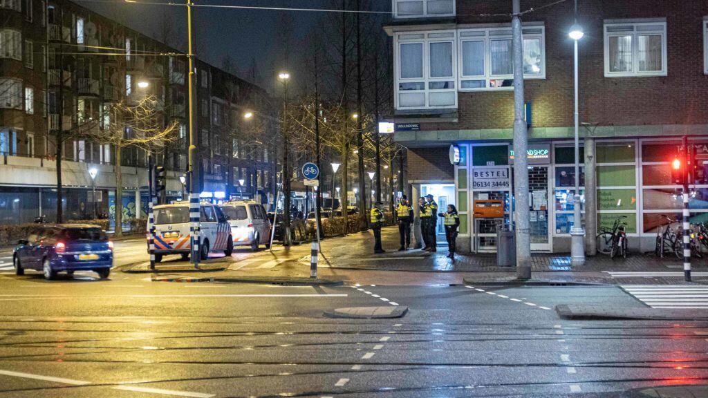 Police officers and vehicles deployed in Amsterdam to overview the curfew. Deserted streets of the Dutch city of Amsterdam and the police checking people for proper documentation and giving fines of 95euro, after the night curfew time and a call for a protest. The fourth day with the curfew in the country is calmer after protests and clashes the previous days. Curfew was imposed to fight the spread of the virus, following the lockdown measures to fight the spike of the Covid-19 Coronavirus cases and the new mutation of the pandemic. the first curfew after World War II has been imposed. Restrictions apply between 21:00-04:30 local time. Citizens can leave their homes only for valid reasons such as health, work or travel. Shops also changed their working hours, while non-essential shops and markets are closed since December. The government took the decision for the lockdown and free movement restriction in order to fight the spread of the new mutation B117 of the coronavirus Covid-19 pandemic. The curfew will be in force at least until February 10, 2021. Amsterdam, the Netherlands on January 27, 2020 (Photo by Nicolas Economou/NurPhoto via Getty Images)
