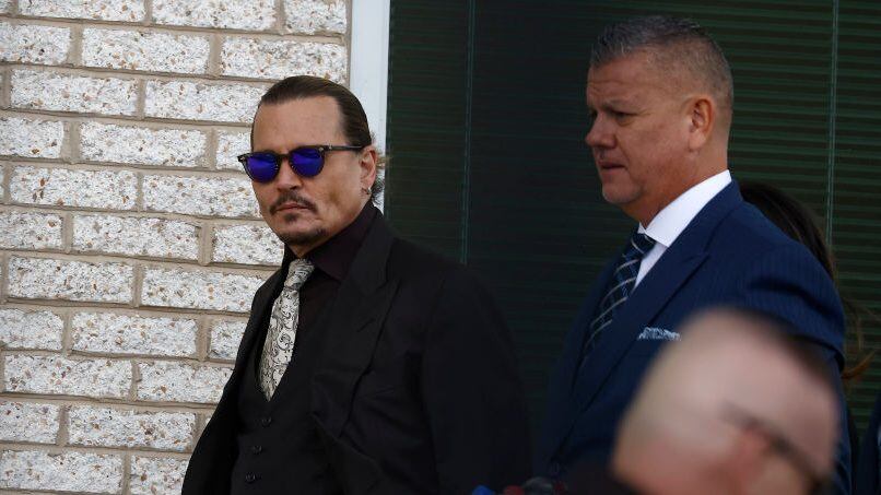 FAIRFAX, VIRGINIA - APRIL 19: Johnny Depp steps outside court during the 8th day of his civil trial at Fairfax County Circuit Court on April 19, 2022 in Fairfax, Virginia. Depp is seeking $50 million in alleged damages to his career over an op-ed Heard wrote in the Washington Post in 2018. (Photo by Paul Morigi/Getty Images)
