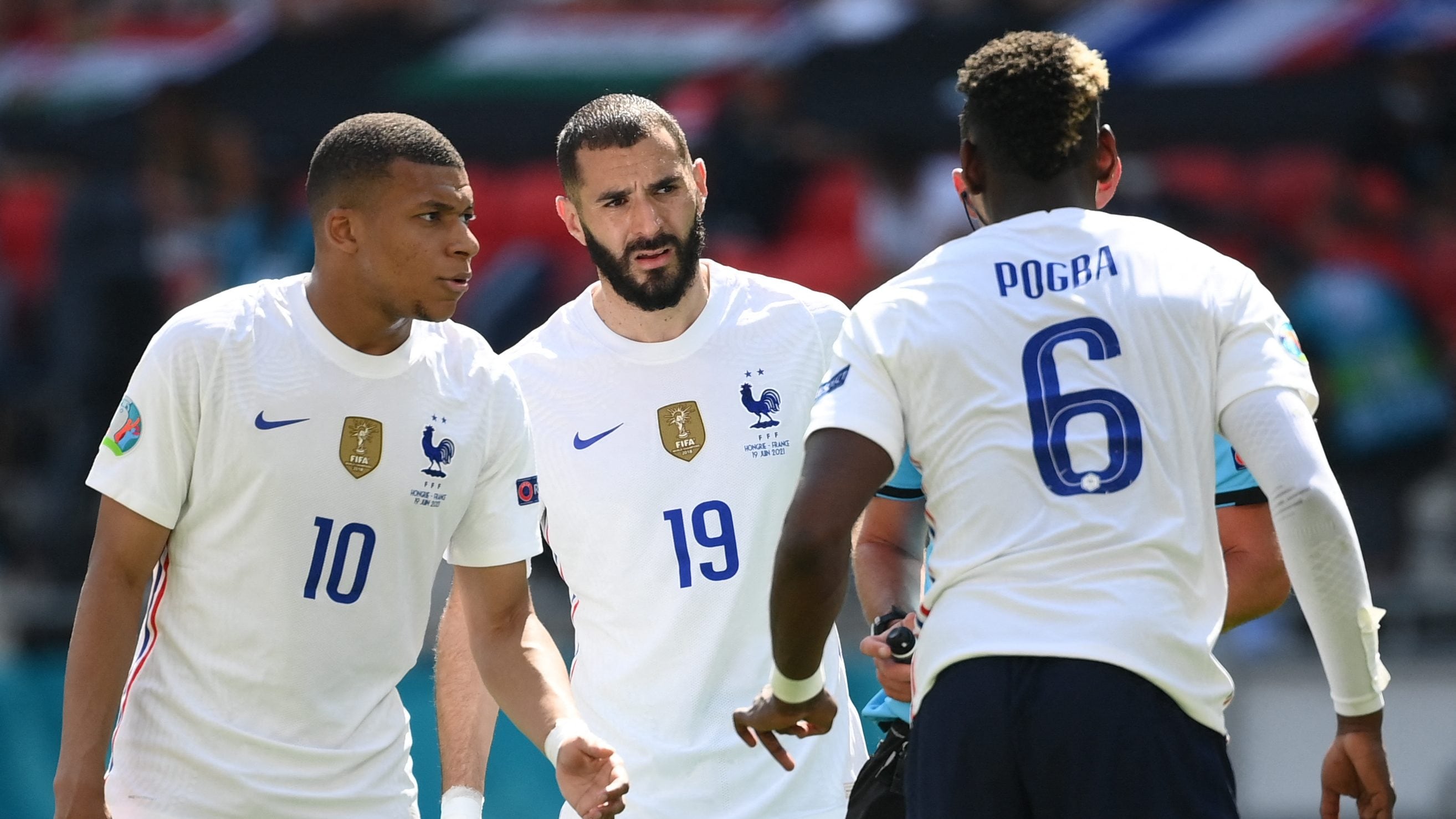 (From L) France's forward Kylian Mbappe, France's forward Karim Benzema (C) and France's midfielder Paul Pogba argue with referee during the UEFA EURO 2020 Group F football match between Hungary and France at Puskas Arena in Budapest on June 19, 2021. (Photo by FRANCK FIFE / POOL / AFP) (Photo by FRANCK FIFE/POOL/AFP via Getty Images)